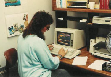 Sue Hastings enters data in the custom database developed using DOS 2.0 in 1986.